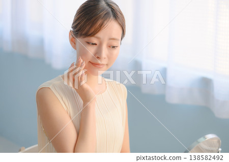 A woman taking care of her skin: Happy Pop A woman taking care of her skin: Happy Pop 138582492