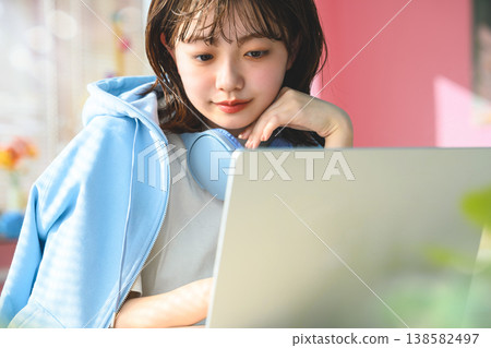 A woman working on her laptop: Happy Pop A woman working on her laptop: Happy Pop 138582497