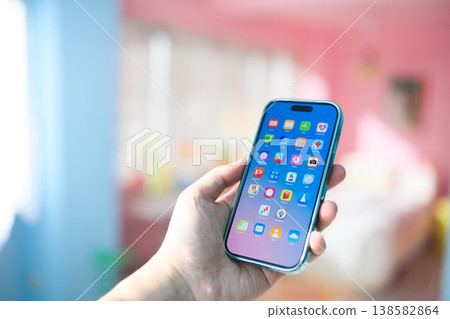 Hand holding a smartphone: Happy Pop Hand holding a smartphone: Happy Pop 138582864