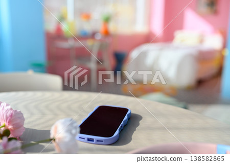 A smartphone placed on the table: Happy Pop 138582865