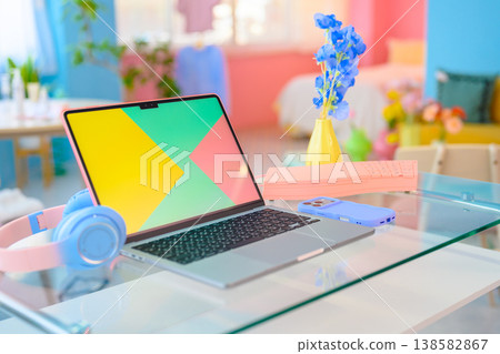 Colorful laptop and headphones on a desk: Happy Pop 138582867