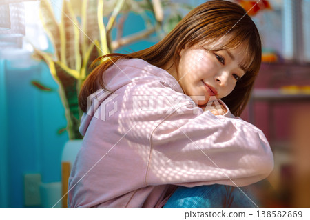 Woman wearing a pink hoodie: Happy Pop 138582869