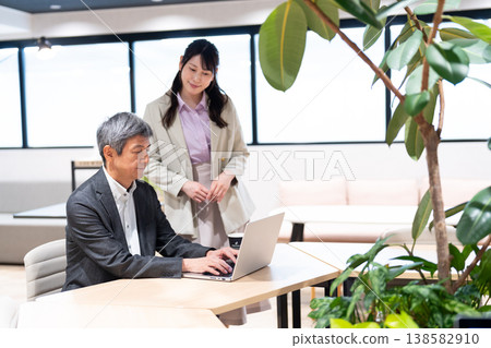 Male and female businessmen offering work-related consultations and advice. Male and female businessmen offering work-related consultations and advice. 138582910