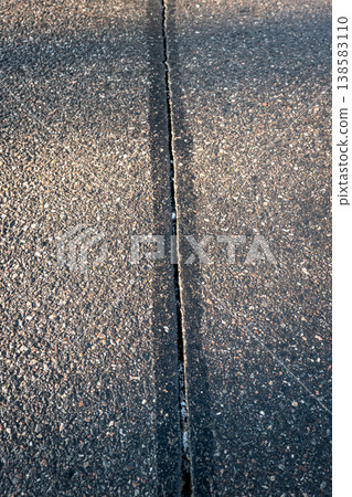 Asphalt Road Pavement Joint Detail Showing Linear Surface Separation Asphalt Road Pavement Joint Detail Showing Linear Surface Separation 138583110