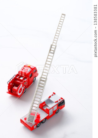 Fire trucks - Fire trucks (ladder trucks and pump trucks) being dispatched. Fire trucks - Fire trucks (ladder trucks and pump trucks) being dispatched. 138583381