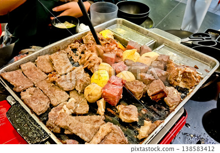 close up view of grilling goat and beef 138583412