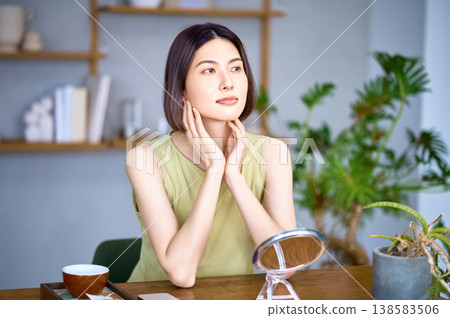 Japanese women with a strong sense of beauty check the condition of their skin in front of the mirror. Japanese women with a strong sense of beauty check the condition of their skin in front of the mirror. 138583506