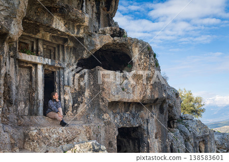 Happy family visiting ancient Greek city Tlos in Lycia located on Lycian way  Famous historical and archeological site. Popular place for family travel on summer vacation. Fethiye, Mugla, Turkey 138583601