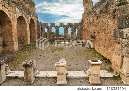 Great Roman bath in rock of ancient Greek city Tlos in Lycia located on Lycian way. Famous historical site In Antalya region. Popular place for family travel on summer vacation. Fethiye, Turkey 138583604