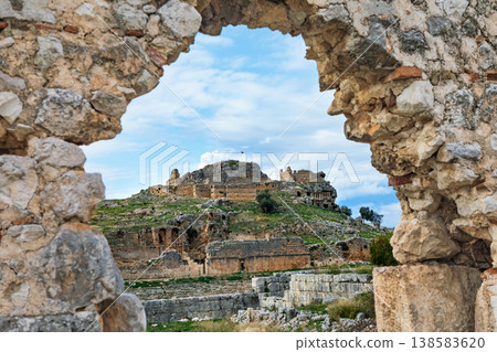 Acropolis, tombs carved in rock of ancient Greek city Tlos in Lycia located on Lycian way. Famous historical site In Antalya region. Popular place for family travel on summer vacation. Fethiye, Turkey 138583620