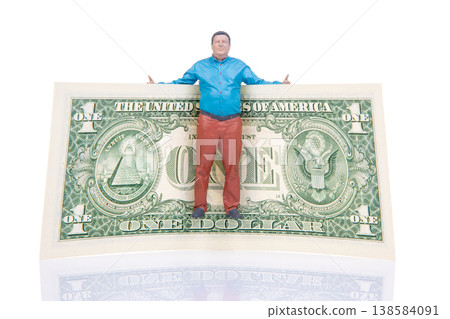 Miniature people interacting with a large one dollar bill in a studio setting during daylight hours 138584091