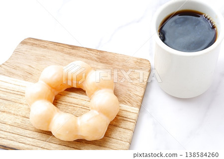 Take a break with a sweet donut and coffee. 138584260