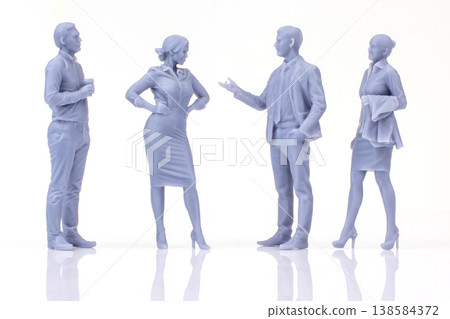 Miniature people engaged in conversation in a modern setting during daylight hours 138584372
