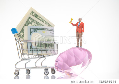 Miniature people with money and treasure on a shopping cart in a simple scene Miniature people with money and treasure on a shopping cart in a simple scene 138584514