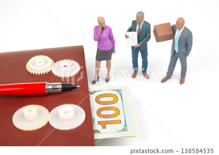 Miniature people interacting around a notebook, gears, and money in a small business setting Miniature people interacting around a notebook, gears, and money in a small business setting 138584535