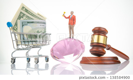 Miniature people showcase money, a trophy, and legal tools in a creative arrangement for a playful Miniature people showcase money, a trophy, and legal tools in a creative arrangement for a playful 138584900
