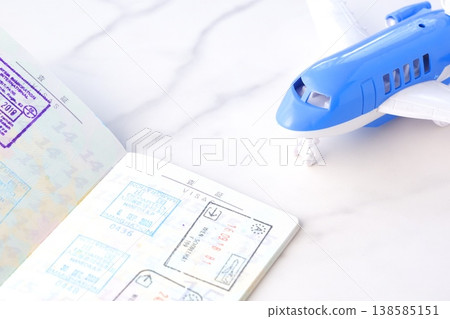 Image of japanese passport with open visa page and airplane, planning to travel abroad for long vacation Image of japanese passport with open visa page and airplane, planning to travel abroad for long vacation 138585151