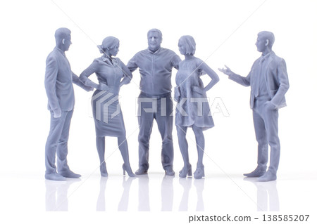 Miniature people engaged in a conversation at a gathering Miniature people engaged in a conversation at a gathering 138585207