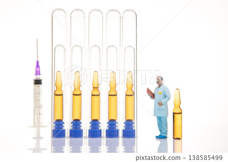 Scientist works with test tubes and syringes in a laboratory setting during the day Scientist works with test tubes and syringes in a laboratory setting during the day 138585499