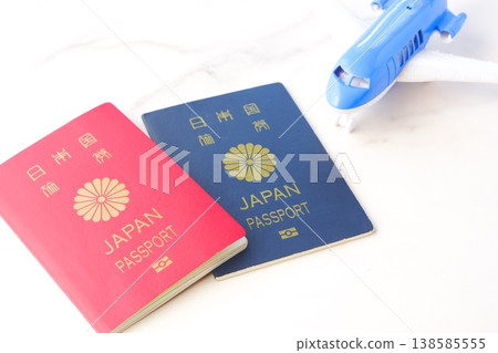 Passport - An image of someone planning an overseas trip for a long vacation, using passports (10-year and 5-year) and an airplane. Passport - An image of someone planning an overseas trip for a long vacation, using passports (10-year and 5-year) and an airplane. 138585555