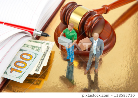 Miniature people in a court setting with money and gavel present in the scene Miniature people in a court setting with money and gavel present in the scene 138585730