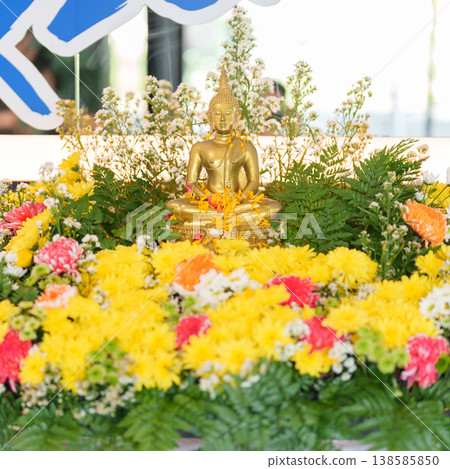 Happy Songkran festival day in Thailand or Thai Happy New Year. hand pouring water on golden Buddha statue with flowers and garland in. Holiday and culture concept 138585850
