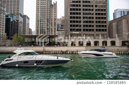 Chicago, Illinois, USA - October 12, 2024: Luxury yacht on among skyscraper building. Downtown architecture. Skyscraper architecture of city with yacht. Chicago downtown cityscape at Chicago river Chicago, Illinois, USA - October 12, 2024: Luxury yacht on among skyscraper building. Downtown architecture. Skyscraper architecture of city with yacht. Chicago downtown cityscape at Chicago river 138585865