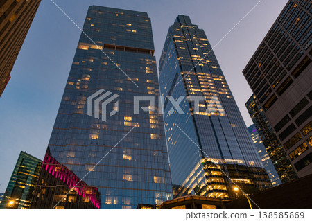 City night illuminated building. Skyscraper cityscape. Night city of Chicago. Business city. Night cityscape of Chicago skyscraper building. Chicago architecture of skyscraper. Twilight glow 138585869