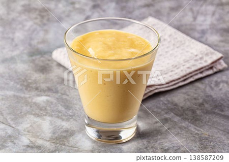 Sweet mango smoothie dessert glass 138587209