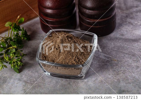 Ground dry black pepper powder Ground dry black pepper powder 138587213