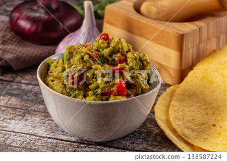 Green spicy Mexican guacamole dip 138587224
