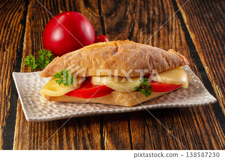 Sandwich with mozzarella and tomato Sandwich with mozzarella and tomato 138587230