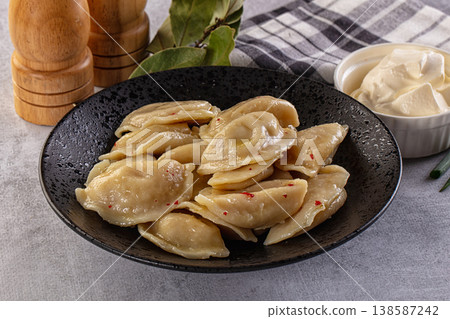 Traditiolal vareniki - stuffed dumplings with potato Traditiolal vareniki - stuffed dumplings with potato 138587242