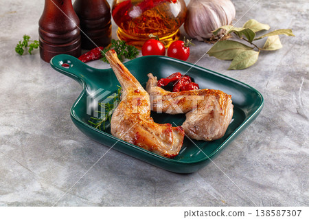 Roasted rabbit leg served rosemary Roasted rabbit leg served rosemary 138587307