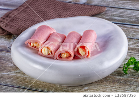 Wrapped ham and cheese roll Wrapped ham and cheese roll 138587356