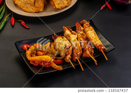 Grilled Chicken Skewers with Melted Cheese and Vegetables Grilled Chicken Skewers with Melted Cheese and Vegetables 138587437