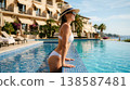 Woman Relaxing in Luxury Resort Infinity Pool 138587481