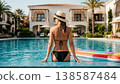 Woman Relaxing in Luxury Resort Infinity Pool 138587484