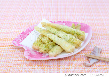 Tempura made from bamboo shoots (specifically, the curved bamboo shoots), served on a plate in spring colors. Tempura made from bamboo shoots (specifically, the curved bamboo shoots), served on a plate in spring colors. 138587510