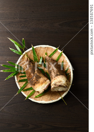 Bamboo shoots with mud still attached, placed in a colander Bamboo shoots with mud still attached, placed in a colander 138587691