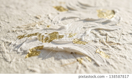 A background with a textured surface reminiscent of Japanese washi paper, adorned with white, three-dimensional wave patterns and gold leaf. A background with a textured surface reminiscent of Japanese washi paper, adorned with white, three-dimensional wave patterns and gold leaf. 138587817
