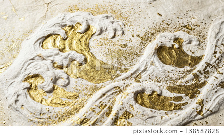 A white wave texture reminiscent of Japanese paper and a gold leaf background. A white wave texture reminiscent of Japanese paper and a gold leaf background. 138587828