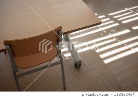 Sunlight shadows on classroom floor with desk Sunlight shadows on classroom floor with desk 138588484