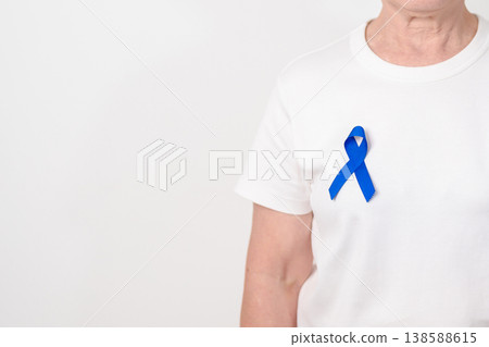 Elderly with dark Blue or Navy blue Ribbon for concept of March Colorectal and Colon Cancer Awareness month, May Arthritis awareness, July Juvenile arthritis and Childhood. Health and world cancer day Elderly with dark Blue or Navy blue Ribbon for concept of March Colorectal and Colon Cancer Awareness month, May Arthritis awareness, July Juvenile arthritis and Childhood. Health and world cancer day 138588615