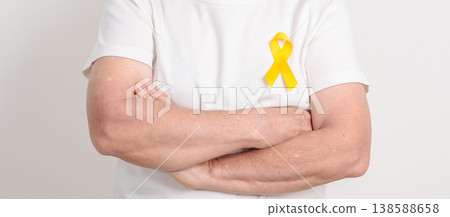 Elderly with Yellow Ribbon for concept of yellow September, Suicide prevention day, Childhood, Pediatric, May Missing Children Awareness day month, support survivor. Healthcare and World Cancer day 138588658