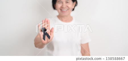 Elderly with Black ribbon for May Melanoma and skin cancer Awareness month, October Vaccine injury awareness month, Mourning Remembrance, March Sleep awareness week, Gang Prevention and Anti Violence Elderly with Black ribbon for May Melanoma and skin cancer Awareness month, October Vaccine injury awareness month, Mourning Remembrance, March Sleep awareness week, Gang Prevention and Anti Violence 138588667