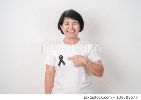 Elderly with Black ribbon for May Melanoma and skin cancer Awareness month, October Vaccine injury awareness month, Mourning Remembrance, March Sleep awareness week, Gang Prevention and Anti Violence Elderly with Black ribbon for May Melanoma and skin cancer Awareness month, October Vaccine injury awareness month, Mourning Remembrance, March Sleep awareness week, Gang Prevention and Anti Violence 138588677