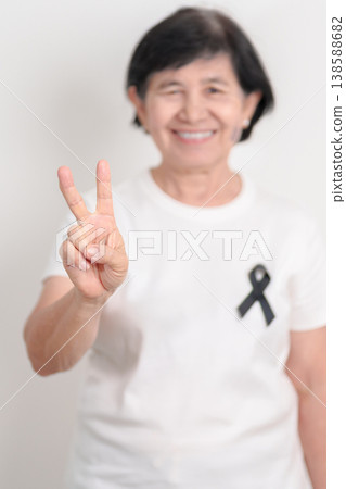 Elderly with Black ribbon for May Melanoma and skin cancer Awareness month, October Vaccine injury awareness month, Mourning Remembrance, March Sleep awareness week, Gang Prevention and Anti Violence Elderly with Black ribbon for May Melanoma and skin cancer Awareness month, October Vaccine injury awareness month, Mourning Remembrance, March Sleep awareness week, Gang Prevention and Anti Violence 138588682