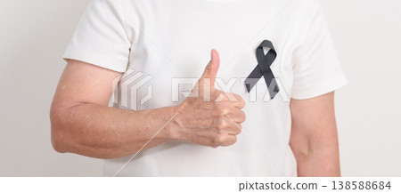Elderly with Black ribbon for May Melanoma and skin cancer Awareness month, October Vaccine injury awareness month, Mourning Remembrance, March Sleep awareness week, Gang Prevention and Anti Violence Elderly with Black ribbon for May Melanoma and skin cancer Awareness month, October Vaccine injury awareness month, Mourning Remembrance, March Sleep awareness week, Gang Prevention and Anti Violence 138588684