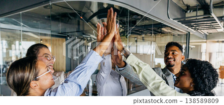 Executives exchange joyful gestures after securing important deal 138589809